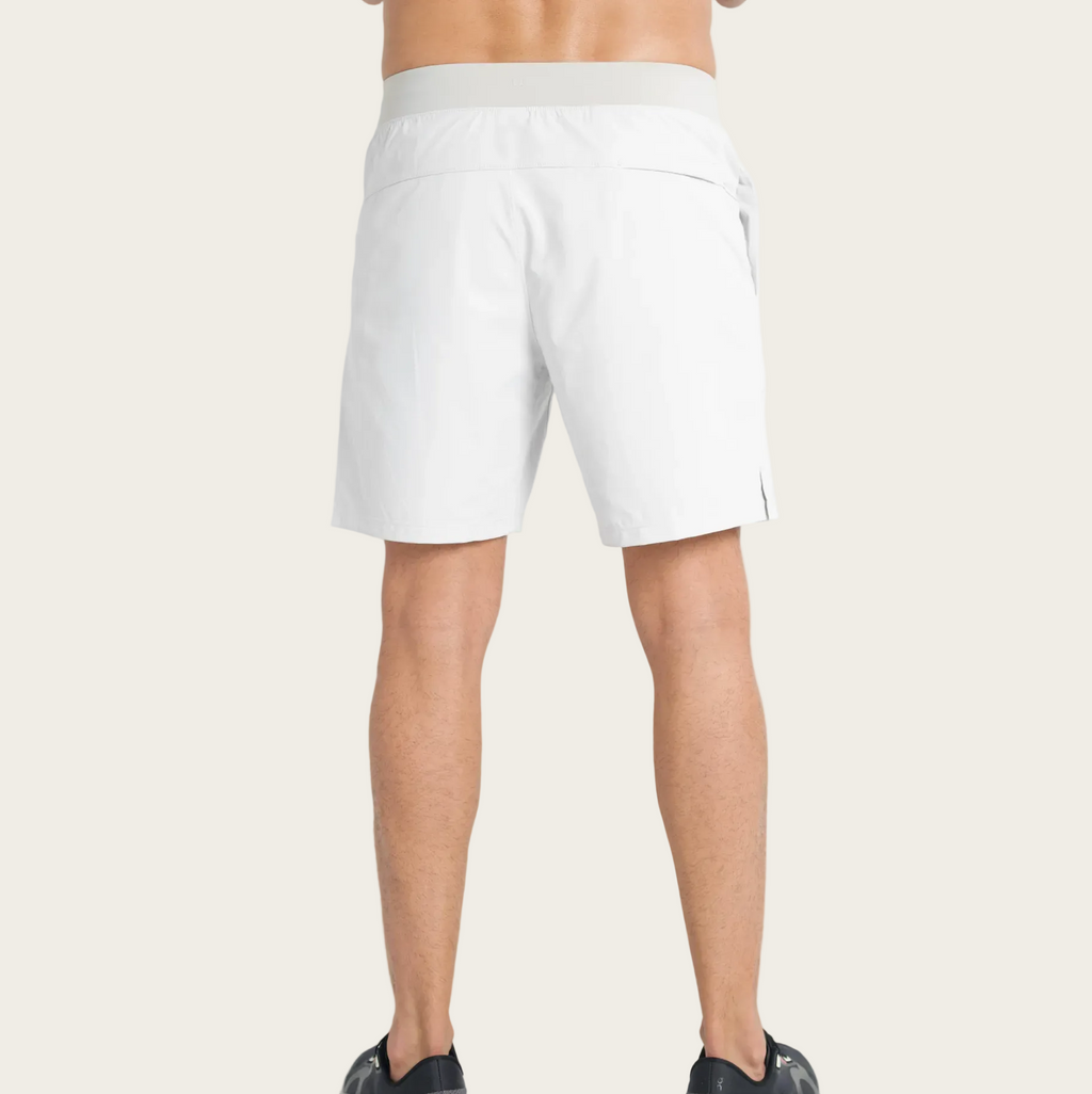 White shorts worn by a person on a white background