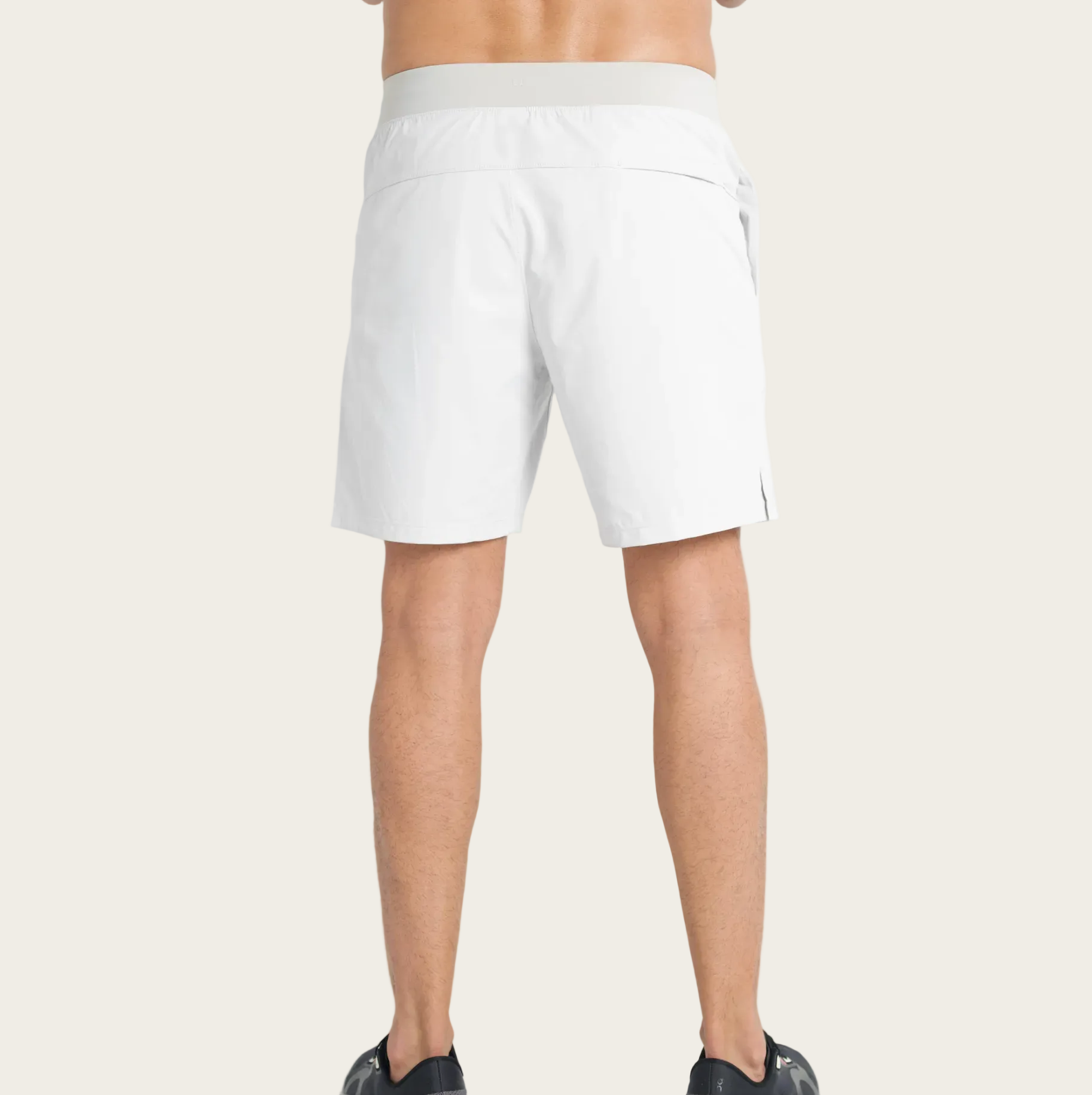 White shorts worn by a person on a white background