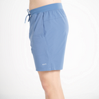 Blue shorts with a drawstring on a white background